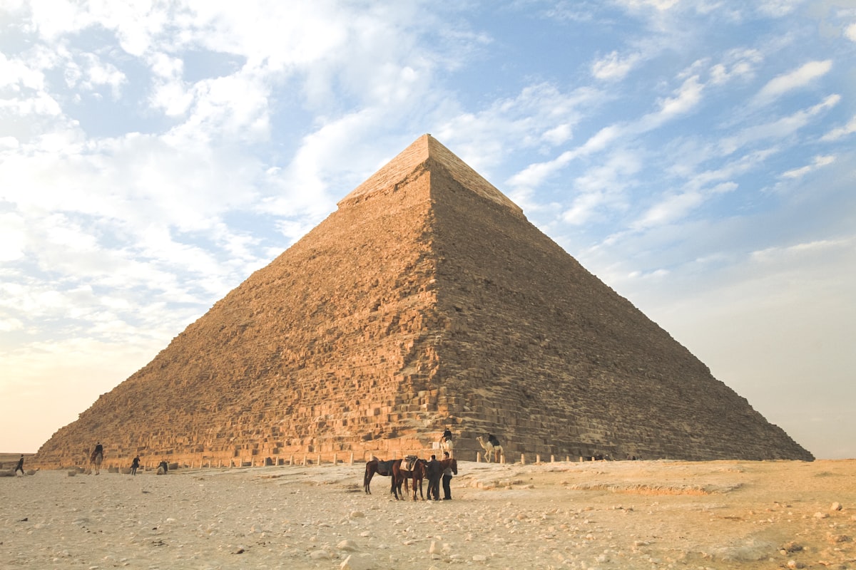 Pyramids and desert plateau on the Nile under clear sky